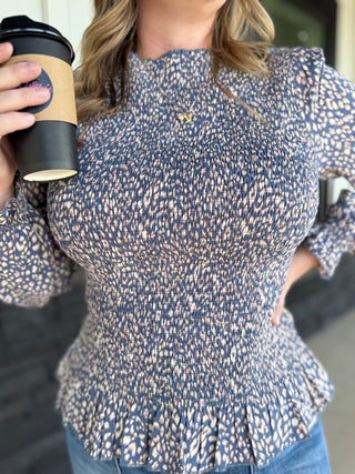 Smocked Peplum Animal Print top