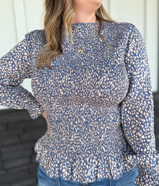 Smocked Peplum Animal Print top